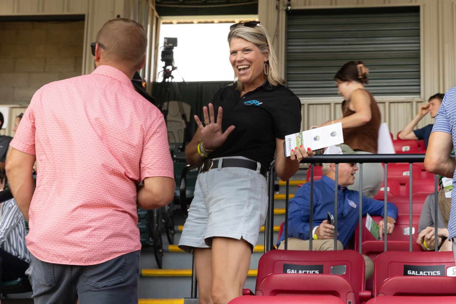 Smiling attendees in the stands